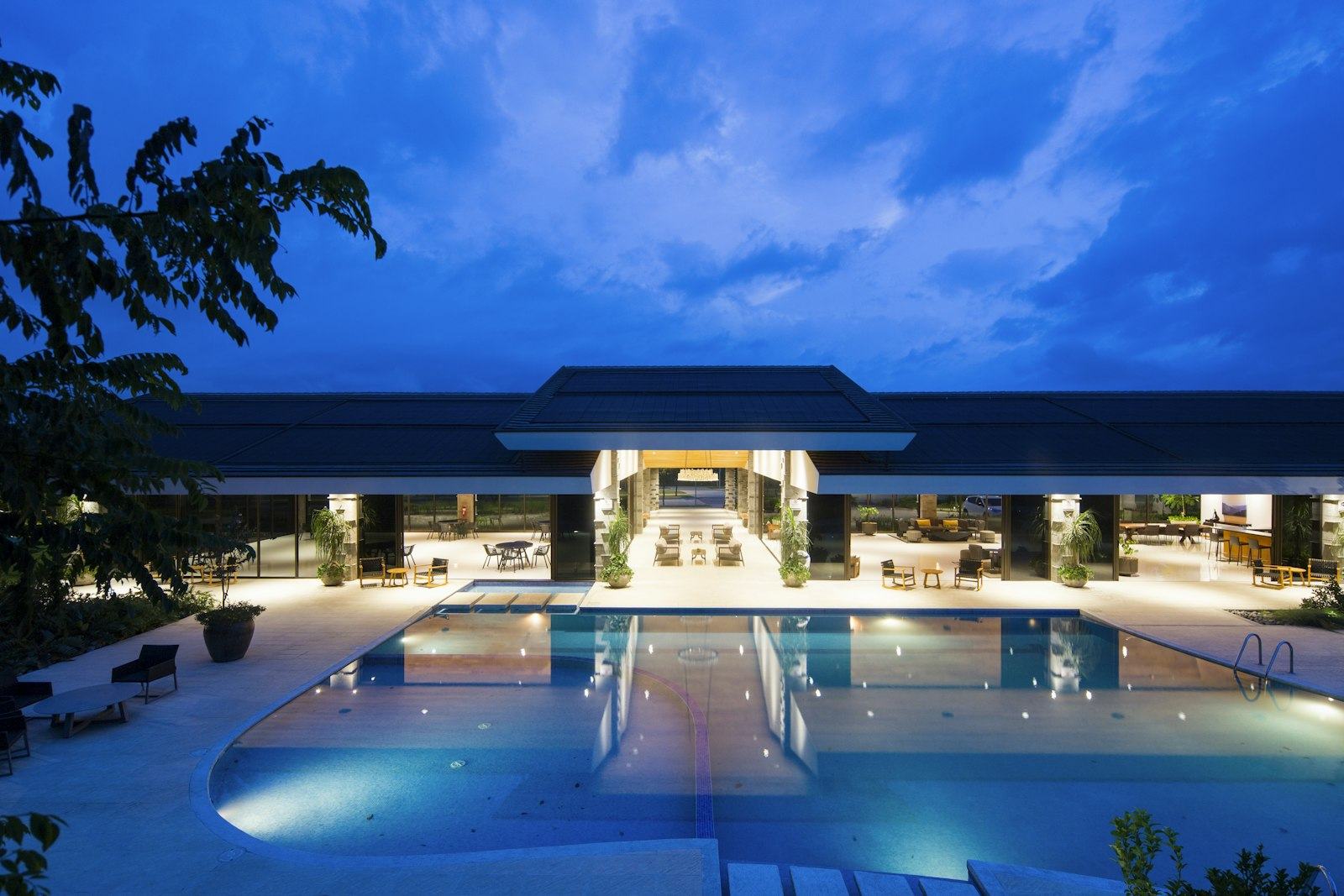 Hotel pool and entrance at dusk